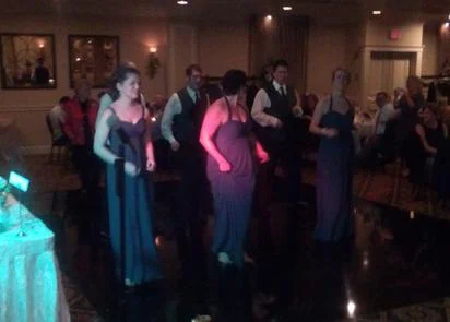 Bridesmaids dancing on the dance floor during a wedding reception